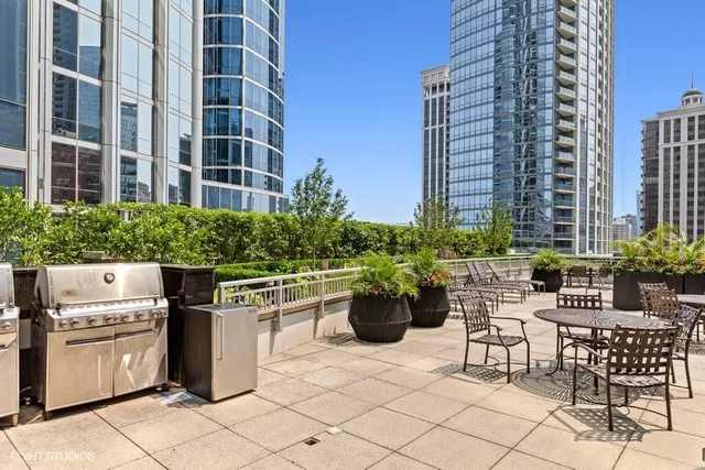 a view of building with outdoor seating and plants