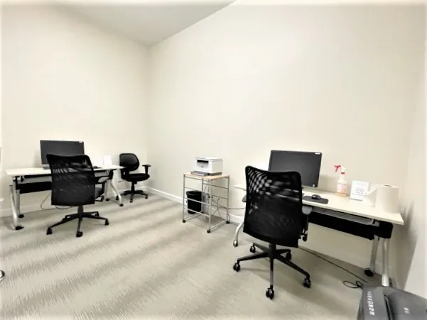 a living room with furniture wooden floor and a large window