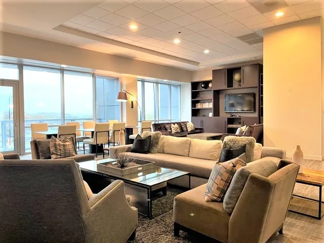 a kitchen with stainless steel appliances kitchen island granite countertop a stove and a sink