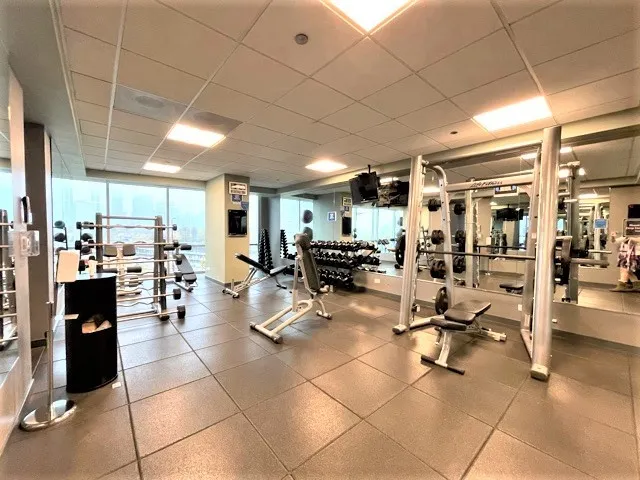 a bedroom with two beds and a couch