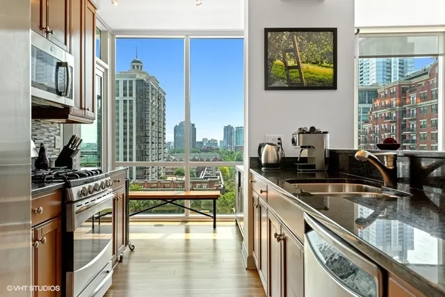 a kitchen with a sink stove and cabinets