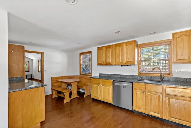 a kitchen with stainless steel appliances granite countertop a sink and cabinets