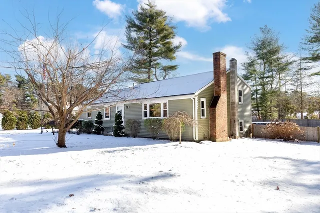 a view of a house with snow on the road