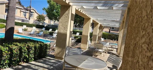 a backyard of a house with outdoor seating