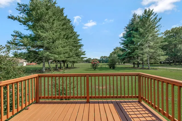 a view of balcony with wooden floor
