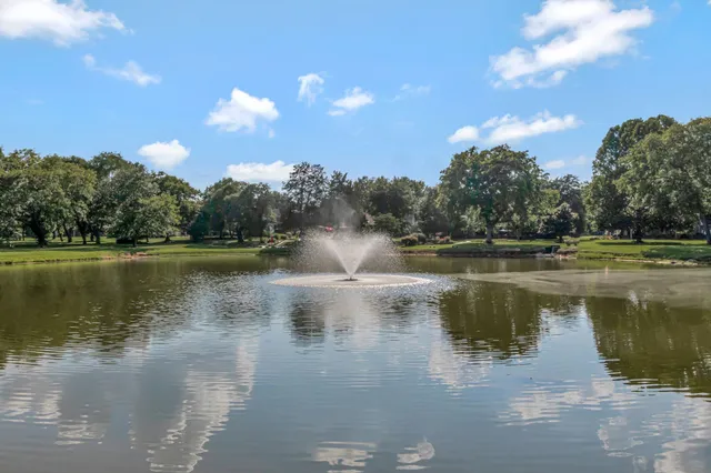 a view of a water with a yard