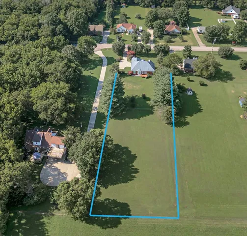an aerial view of residential house with outdoor space