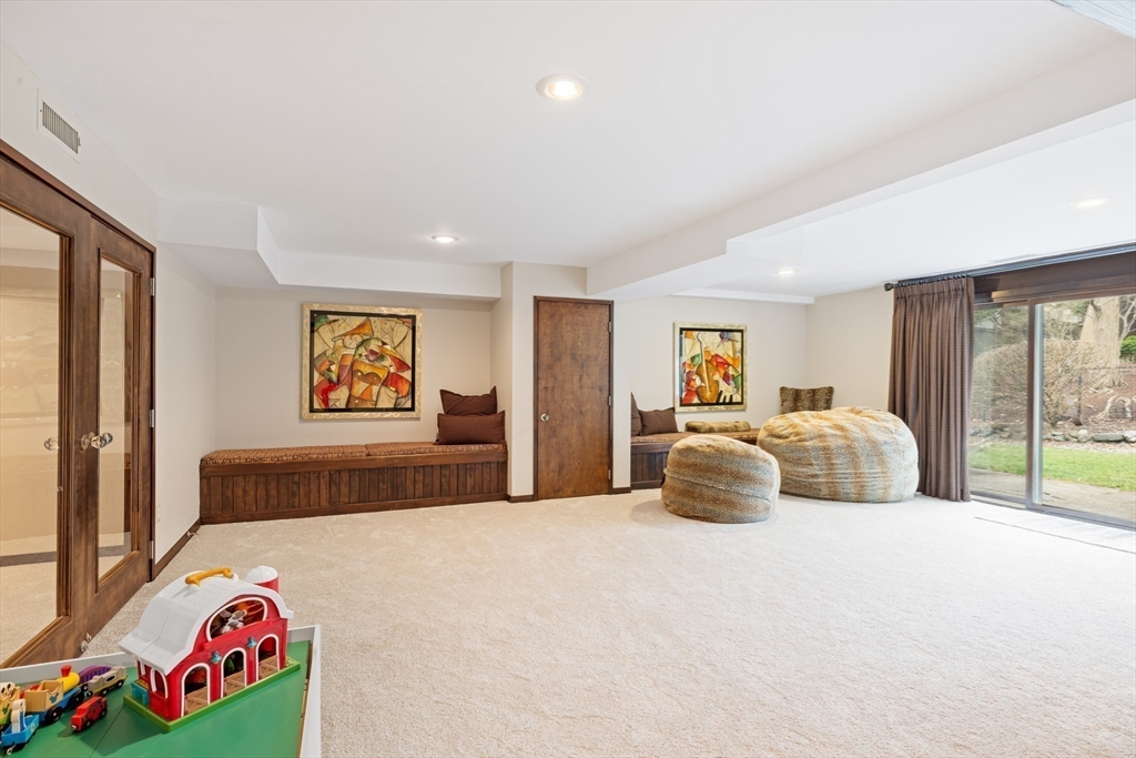 363 Brookline Street Newton, MA 02459 - Photo 23 of 30 a bedroom with a bed and a couch