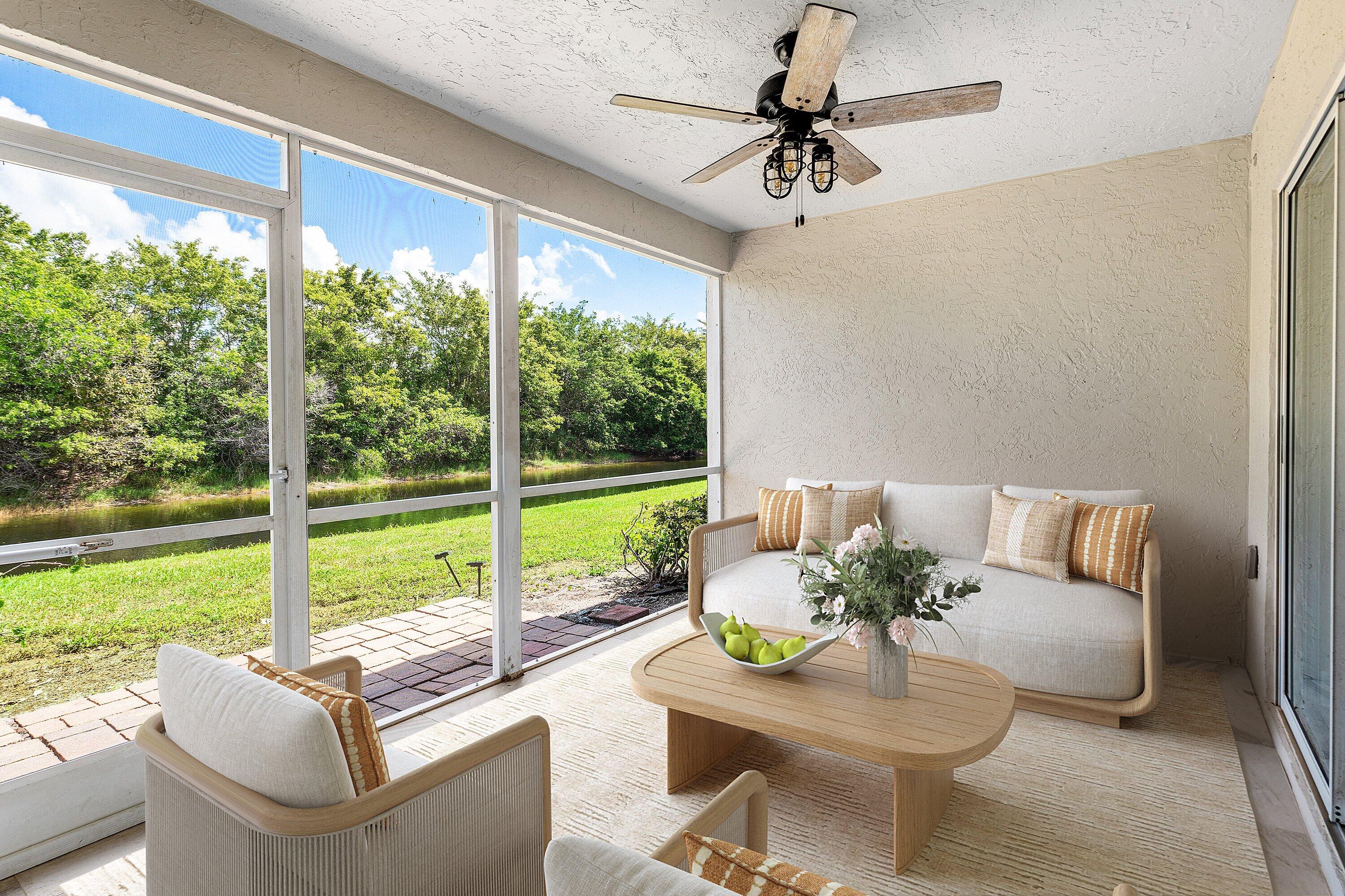 11163 180th Court South Boca Raton, FL 33498 - Photo 4 of 22 a living room with furniture and a garden