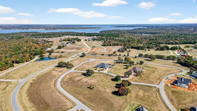 an aerial view of a house with a swimming pool