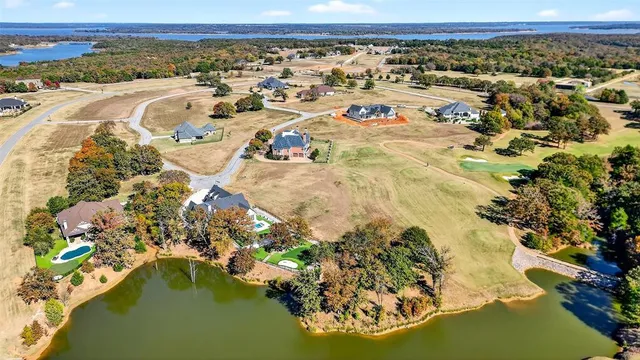 a view of a house with backyard and a sitting area