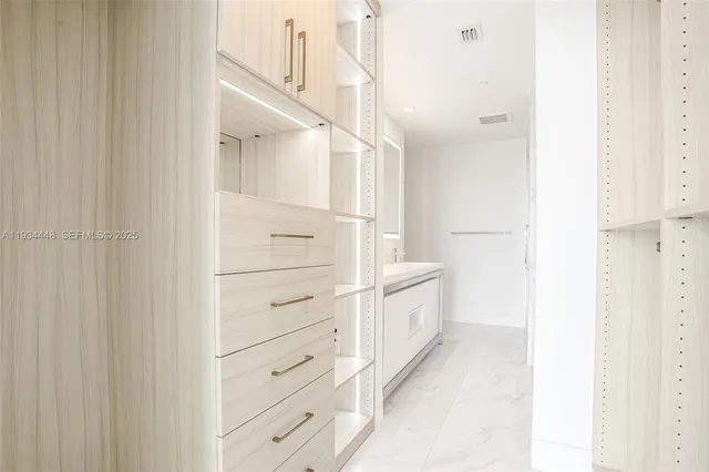a spacious bathroom with sink shower and bathtub