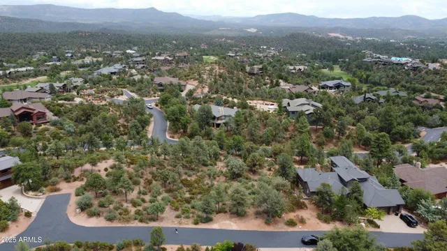 an aerial view of residential house and green space