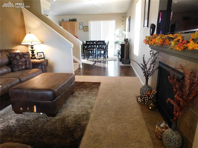 2185 Reed Grass Way Colorado Springs, CO 80915 - Photo 2 of 15 inviting living room greets you as you walk in the door
