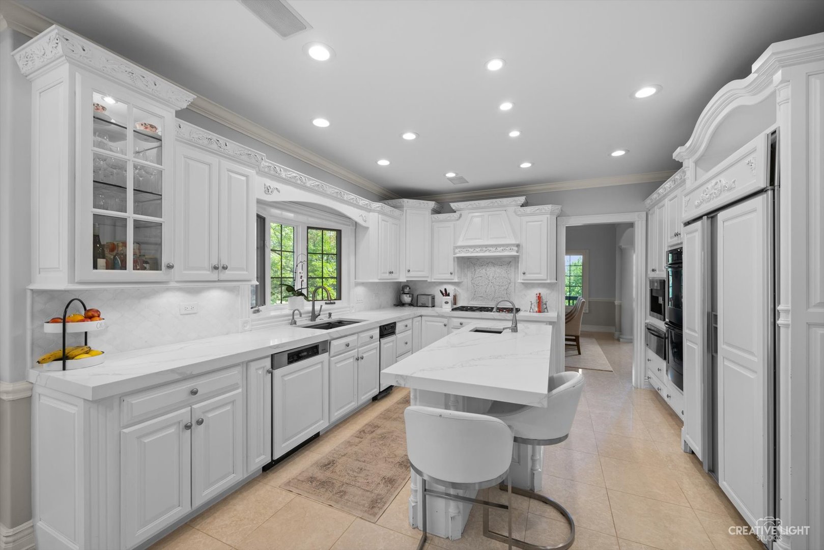 1201 Kenmare Drive Burr Ridge, IL 60527 - Photo 14 of 53 a kitchen with a sink stainless steel appliances and window