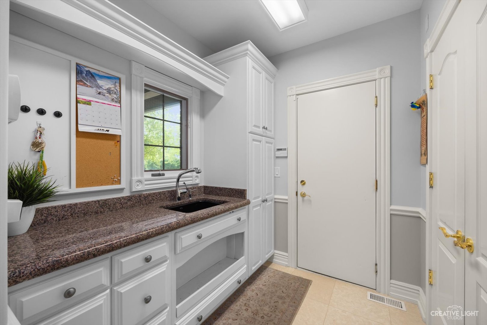 1201 Kenmare Drive Burr Ridge, IL 60527 - Photo 16 of 53 a bathroom with a granite countertop sink and a mirror