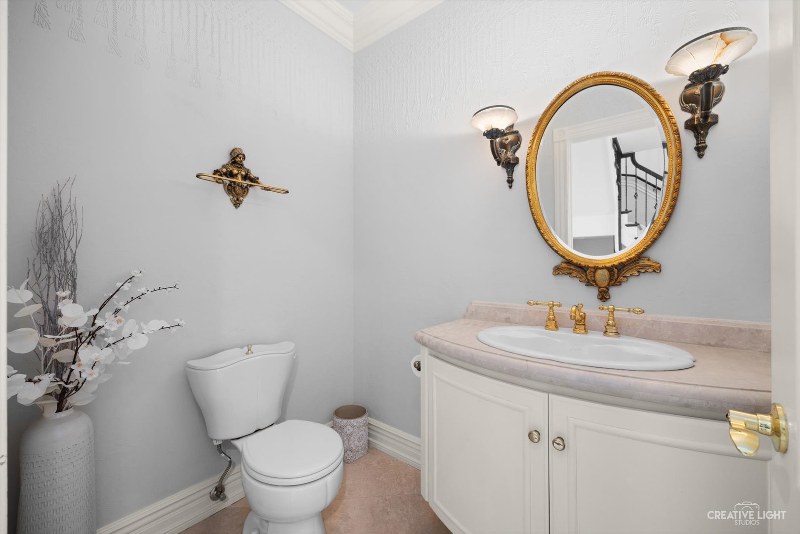 1201 Kenmare Drive Burr Ridge, IL 60527 - Photo 17 of 53 a bathroom with a toilet a sink and a mirror