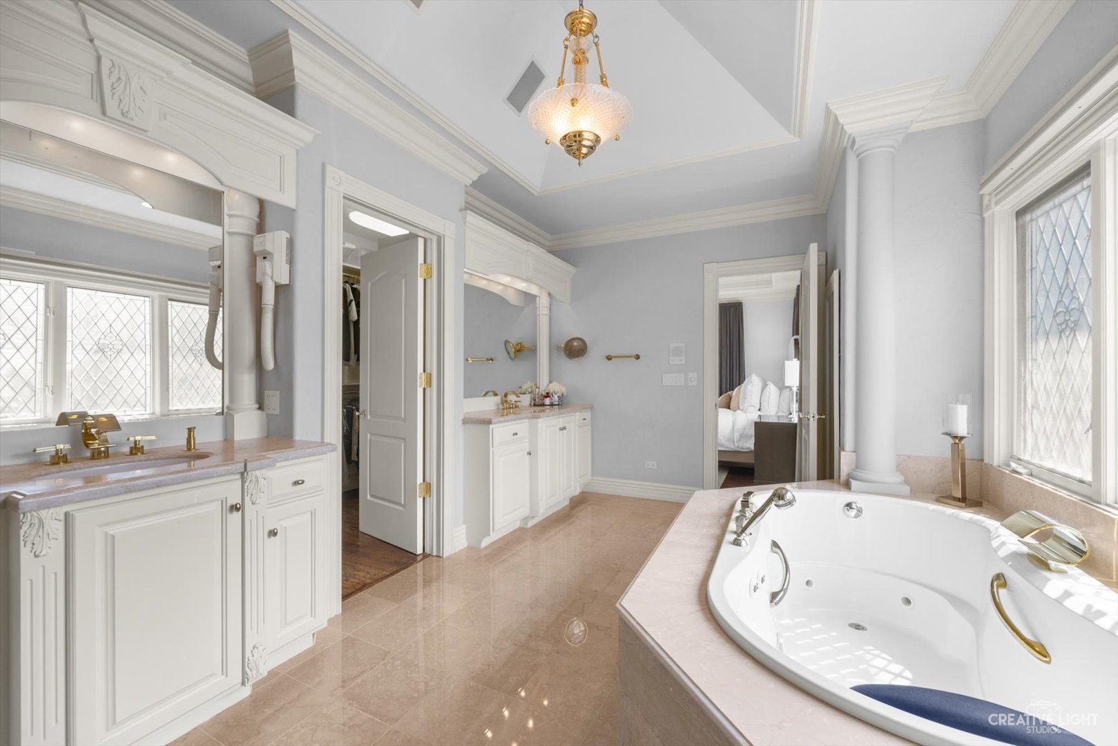 1201 Kenmare Drive Burr Ridge, IL 60527 - Photo 21 of 53 a large bathroom with a tub sink shower and mirror