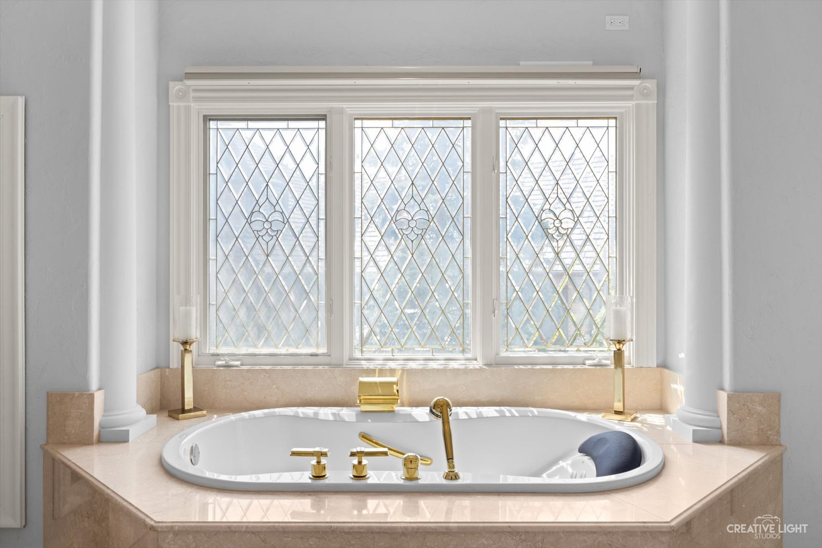 1201 Kenmare Drive Burr Ridge, IL 60527 - Photo 22 of 53 a bathroom with bathtub and window