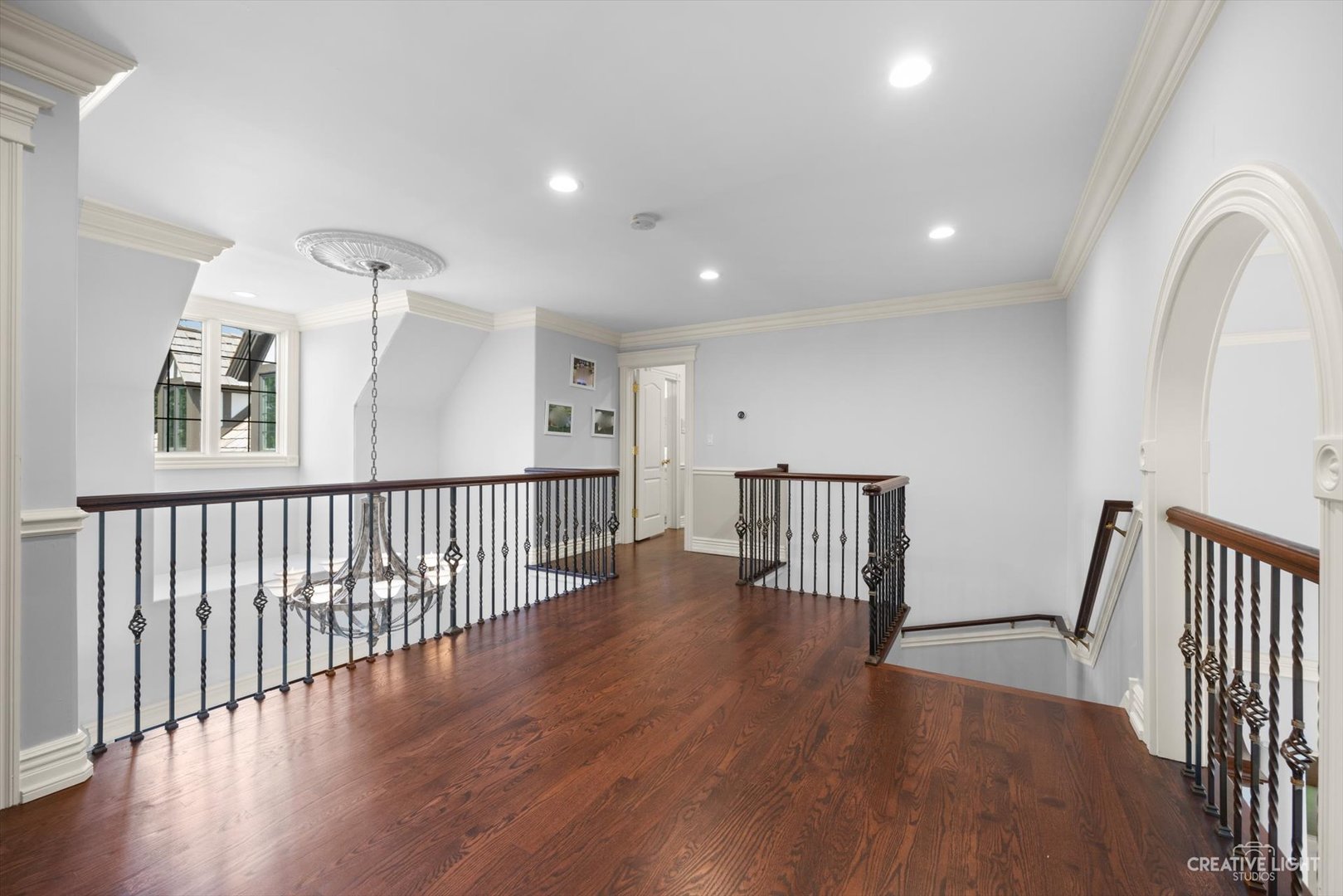 1201 Kenmare Drive Burr Ridge, IL 60527 - Photo 23 of 53 a view of a hallway with wooden floor and windows