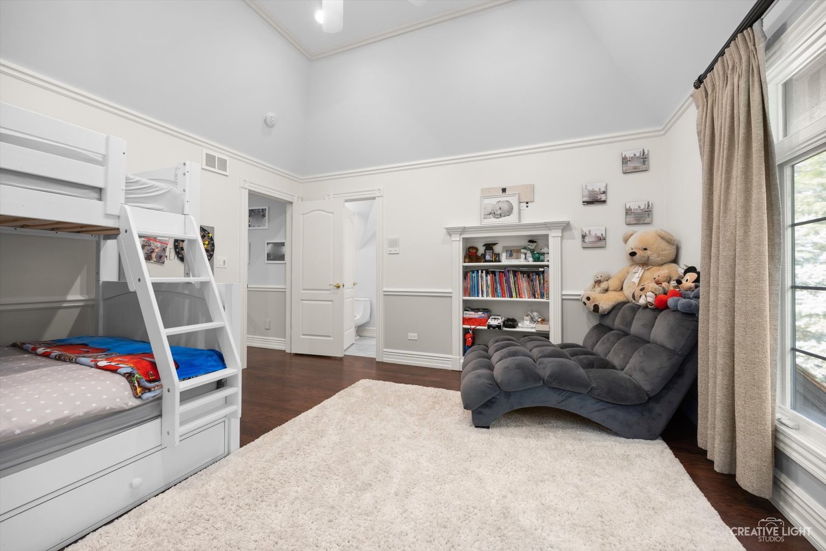 1201 Kenmare Drive Burr Ridge, IL 60527 - Photo 25 of 53 a bedroom with furniture and a book shelf