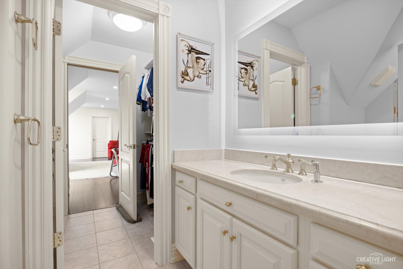 1201 Kenmare Drive Burr Ridge, IL 60527 - Photo 26 of 53 a bathroom with a sink and a mirror