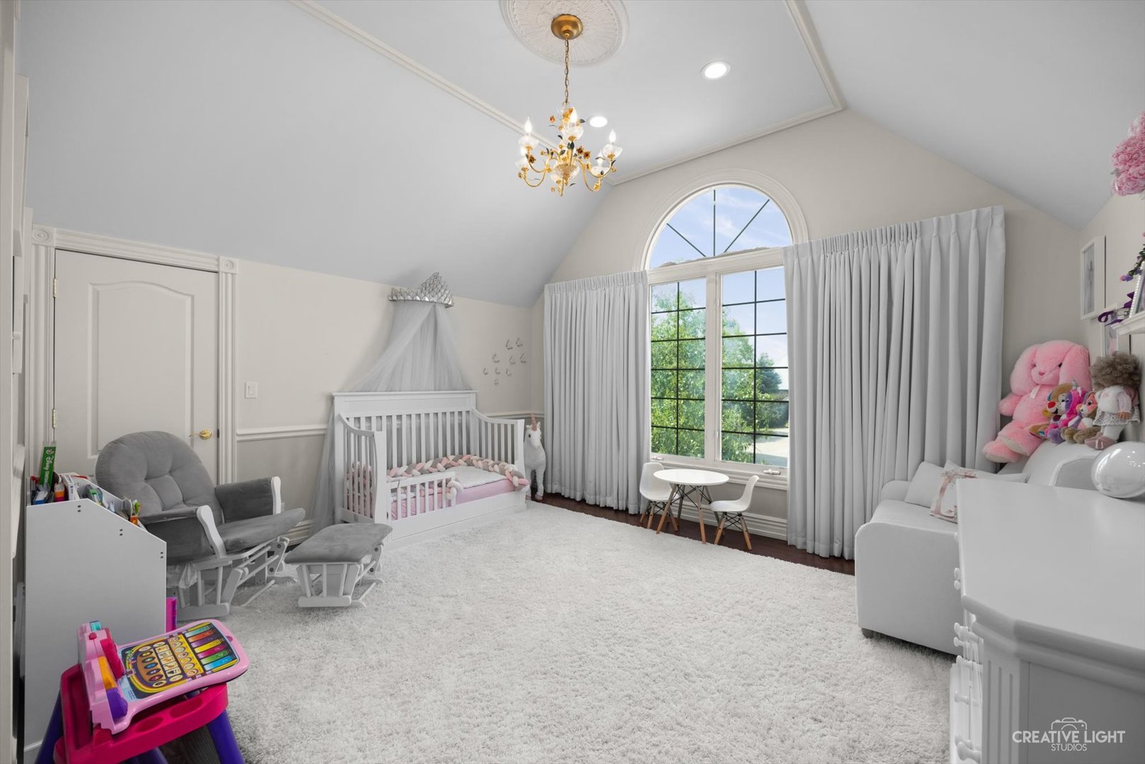 1201 Kenmare Drive Burr Ridge, IL 60527 - Photo 29 of 53 a bed room with furniture and a chandelier