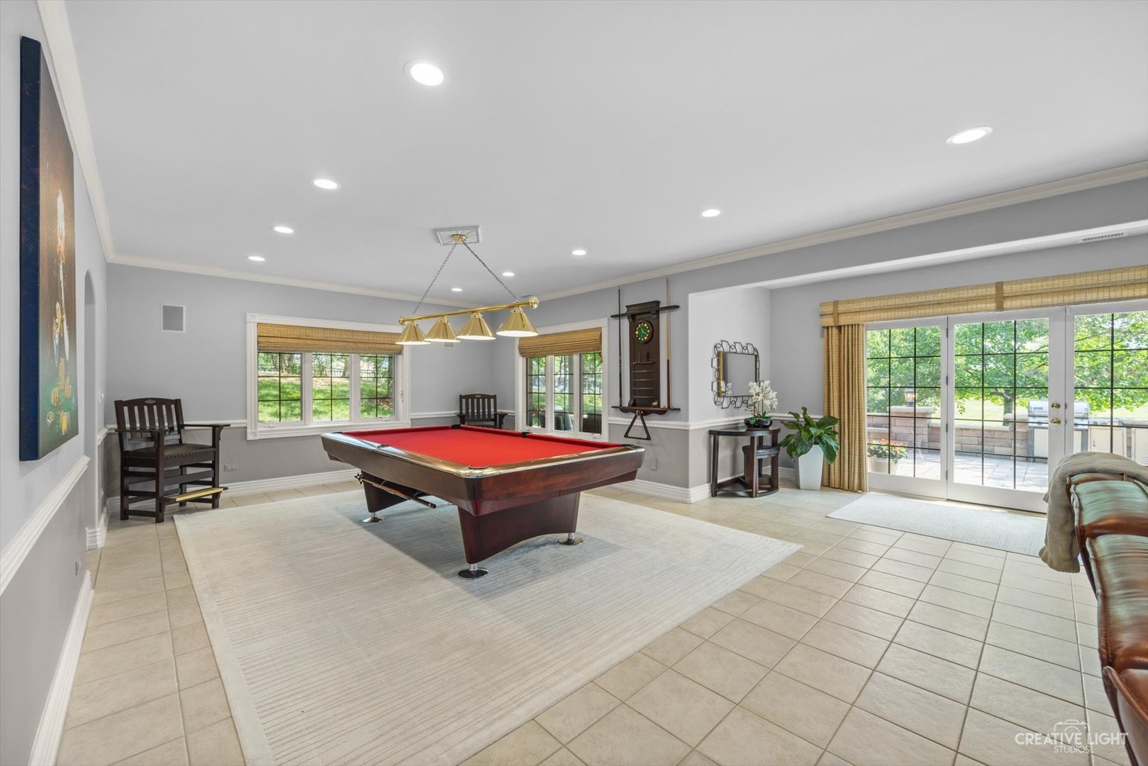 1201 Kenmare Drive Burr Ridge, IL 60527 - Photo 32 of 53 a room with pool table and glass windows