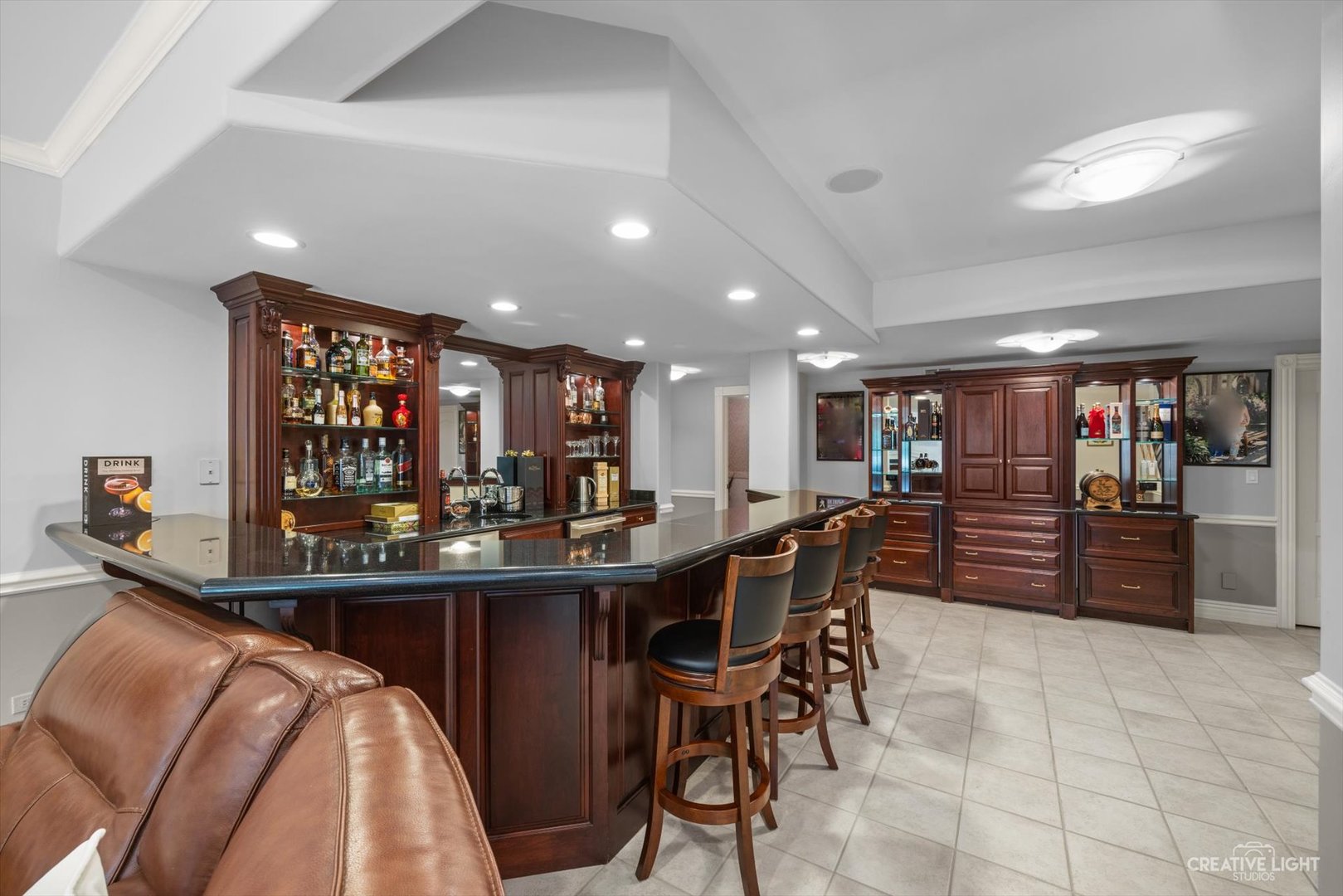 1201 Kenmare Drive Burr Ridge, IL 60527 - Photo 35 of 53 a room with stainless steel appliances kitchen island granite countertop a table and chairs in it