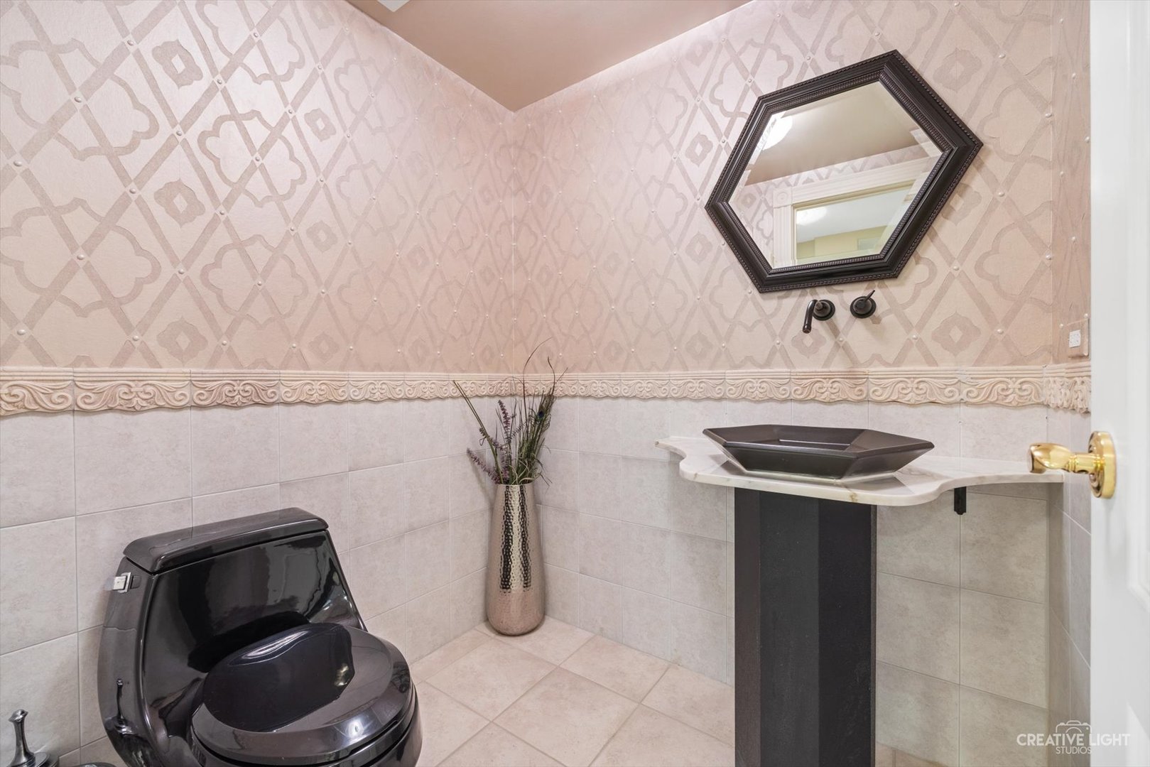 1201 Kenmare Drive Burr Ridge, IL 60527 - Photo 38 of 53 a bathroom with a toilet and a sink