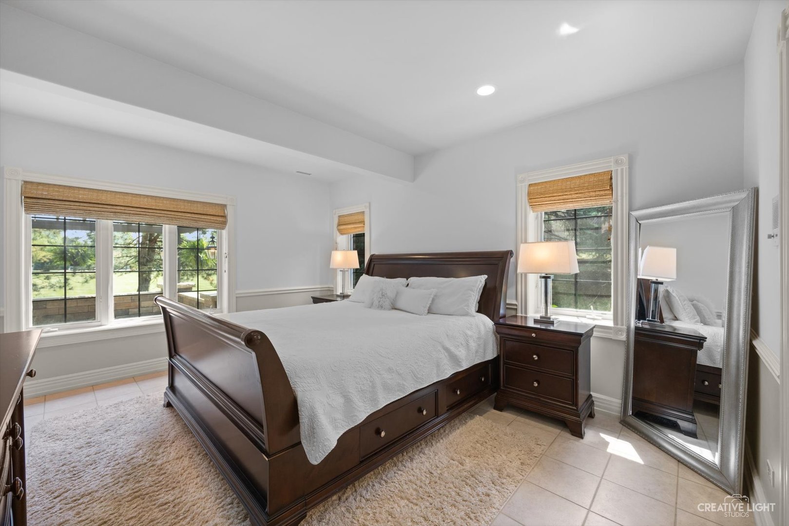1201 Kenmare Drive Burr Ridge, IL 60527 - Photo 40 of 53 a large bed sitting in a bedroom next to a window