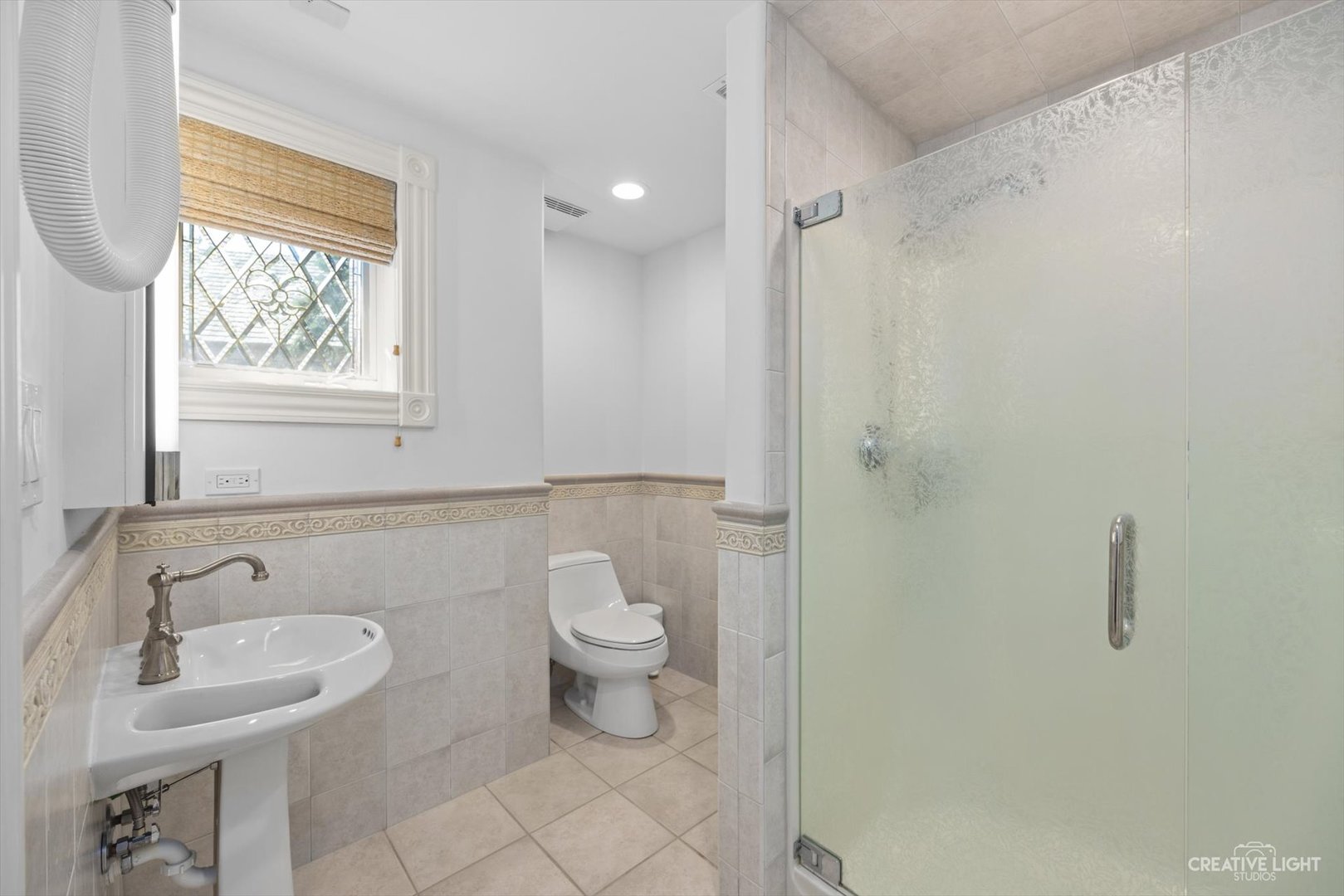 1201 Kenmare Drive Burr Ridge, IL 60527 - Photo 41 of 53 a bathroom with a sink toilet and shower
