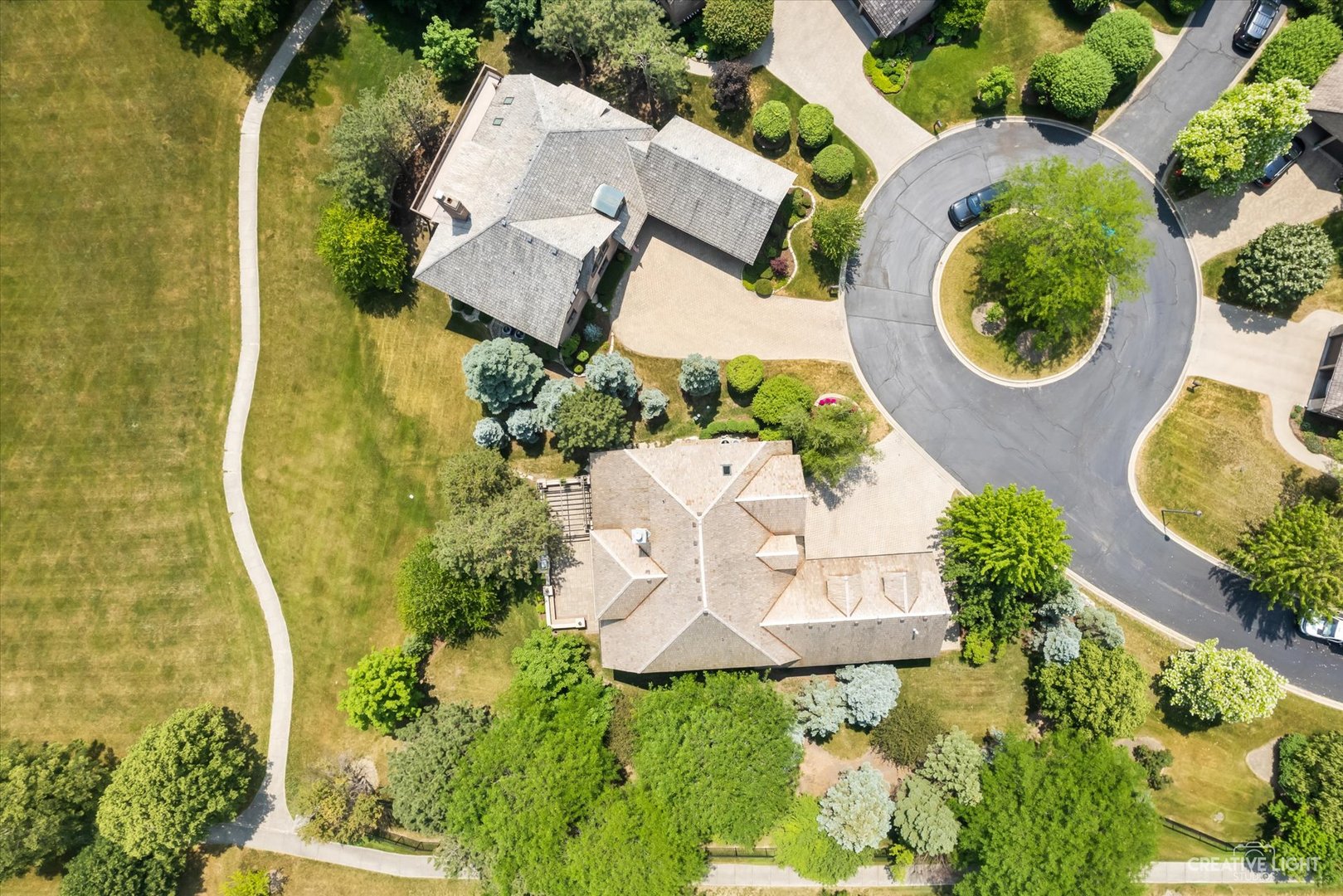 1201 Kenmare Drive Burr Ridge, IL 60527 - Photo 51 of 53 an aerial view of a house with a yard and tennis court