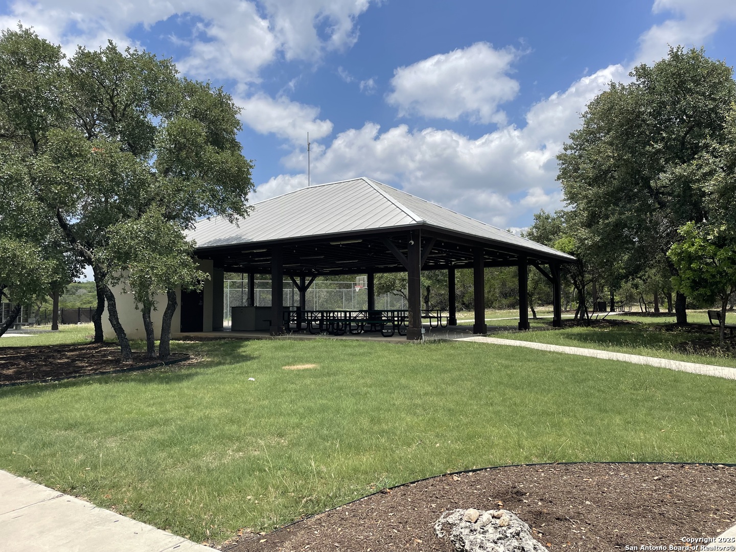 218 PR 1748 Mico, TX 78056 - Photo 5 of 16 a front view of a house with garden