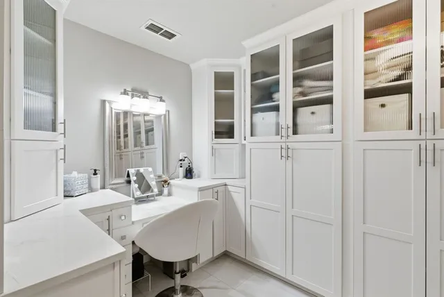 a dining room with furniture and view of kitchen