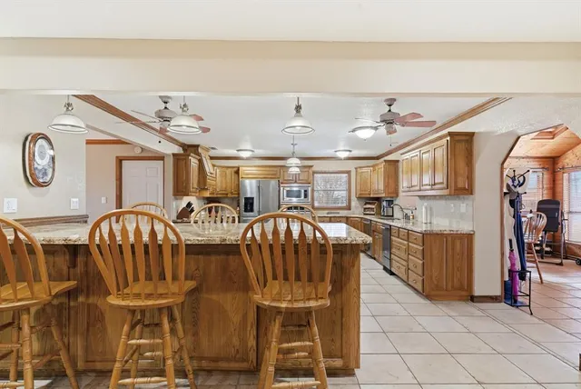 a view of a kitchen with furniture and a chandelier