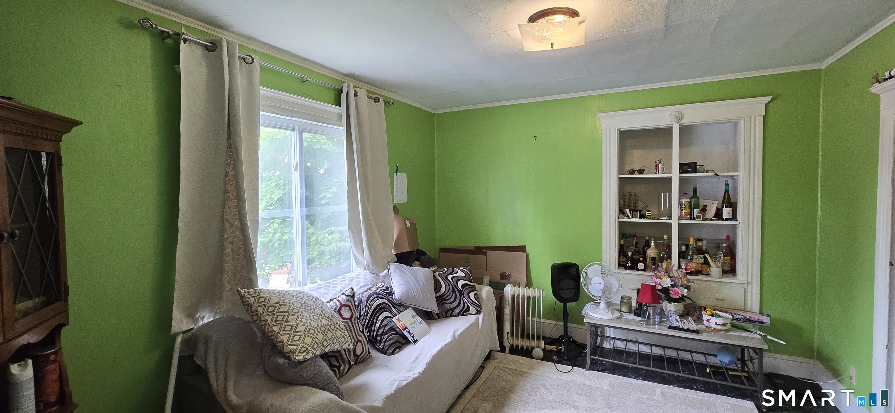 25 High Street Torrington, CT 06790 - Photo 14 of 16 a living room with furniture and a window