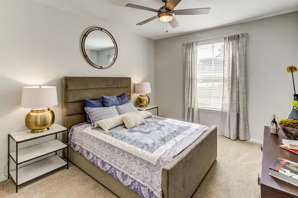 a bedroom with a bed and window