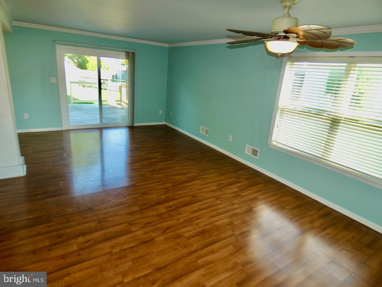 335 Marldale Drive Middletown, DE 19709 - Photo 12 of 58 a view of a room with wooden floor and windows