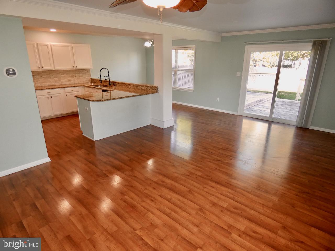 335 Marldale Drive Middletown, DE 19709 - Photo 14 of 58 a kitchen with stainless steel appliances granite countertop a sink and a wooden floors