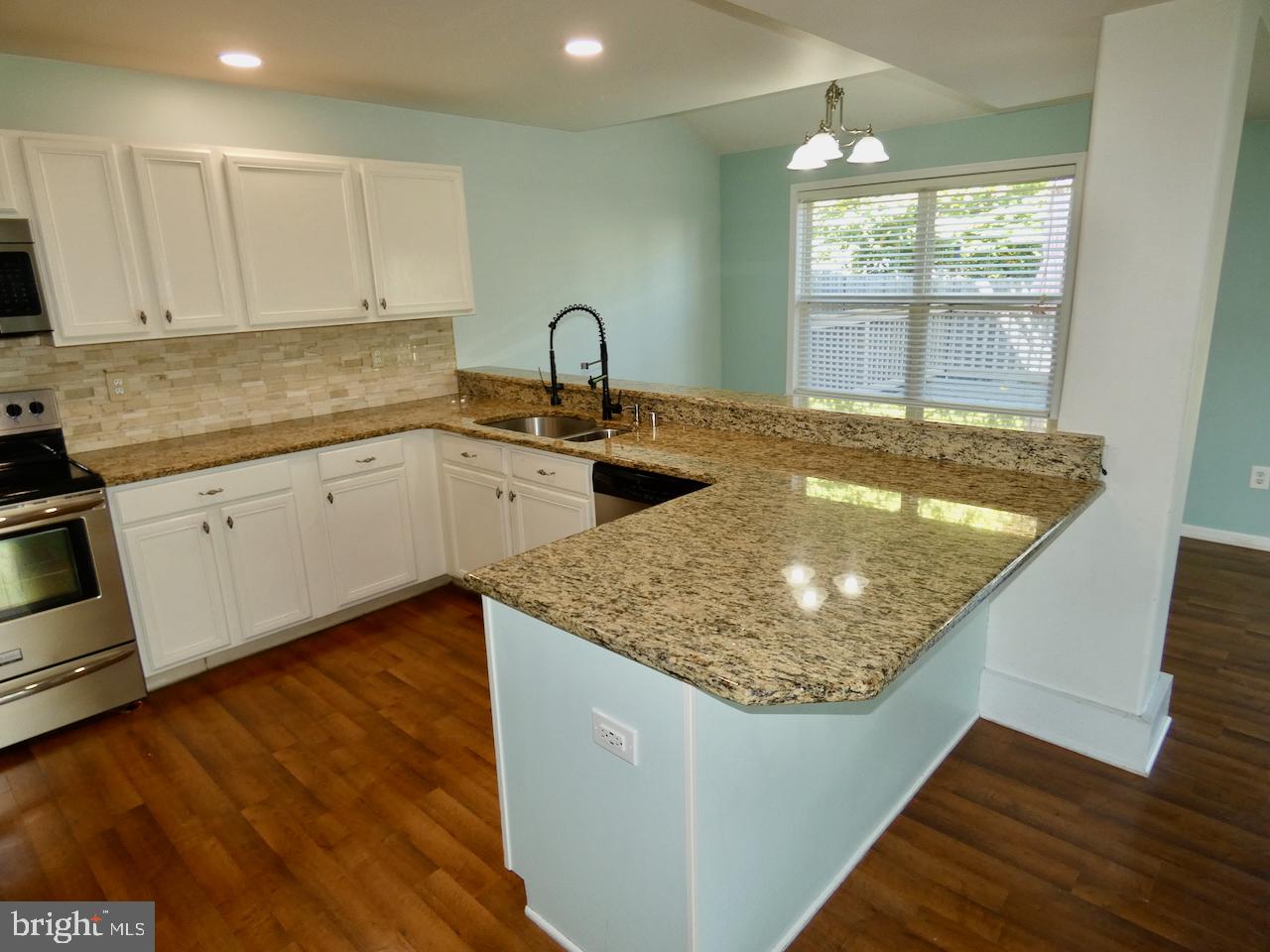 335 Marldale Drive Middletown, DE 19709 - Photo 23 of 58 a kitchen with sink refrigerator and window