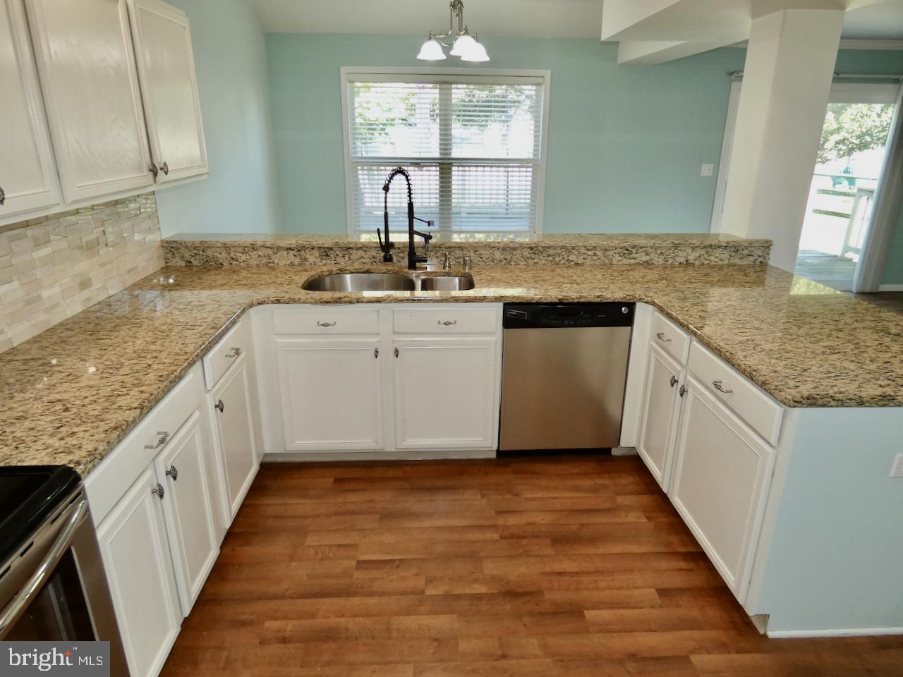 335 Marldale Drive Middletown, DE 19709 - Photo 26 of 58 a kitchen with granite countertop counter space a sink and appliances