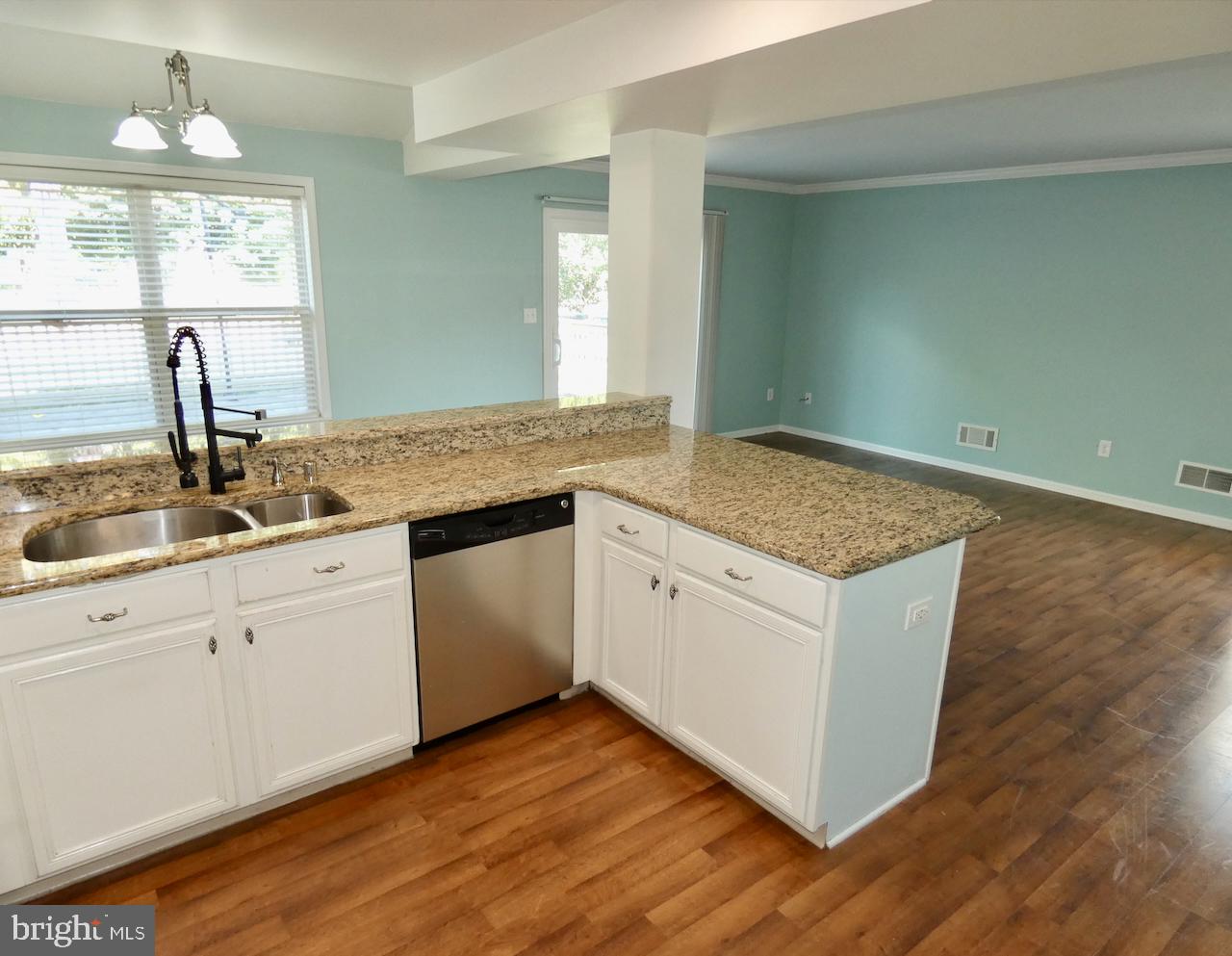335 Marldale Drive Middletown, DE 19709 - Photo 27 of 58 a kitchen with granite countertop white cabinets and a granite counter tops