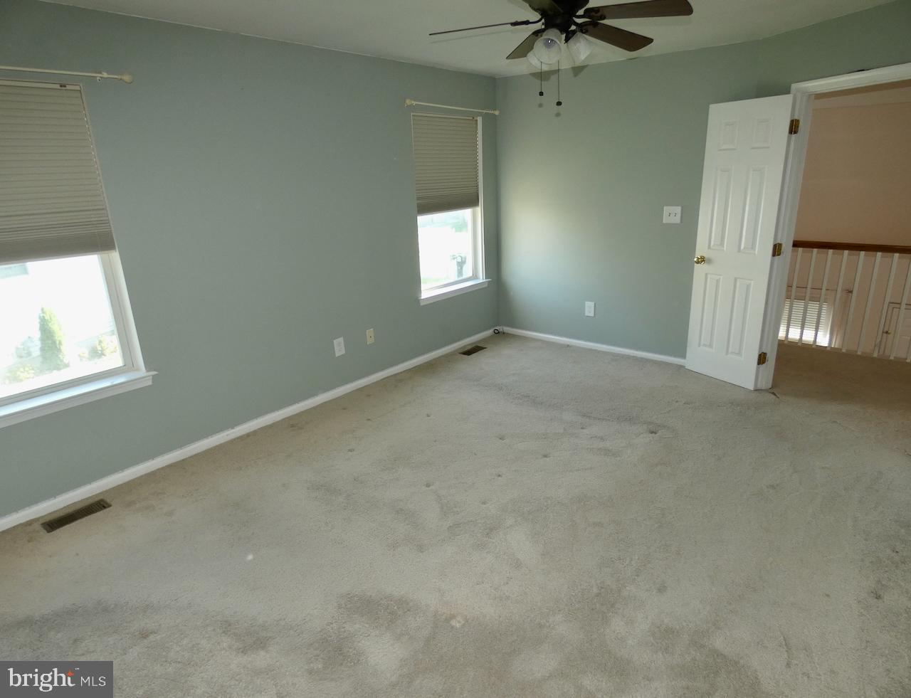 335 Marldale Drive Middletown, DE 19709 - Photo 34 of 58 an empty room with a window and a ceiling fan