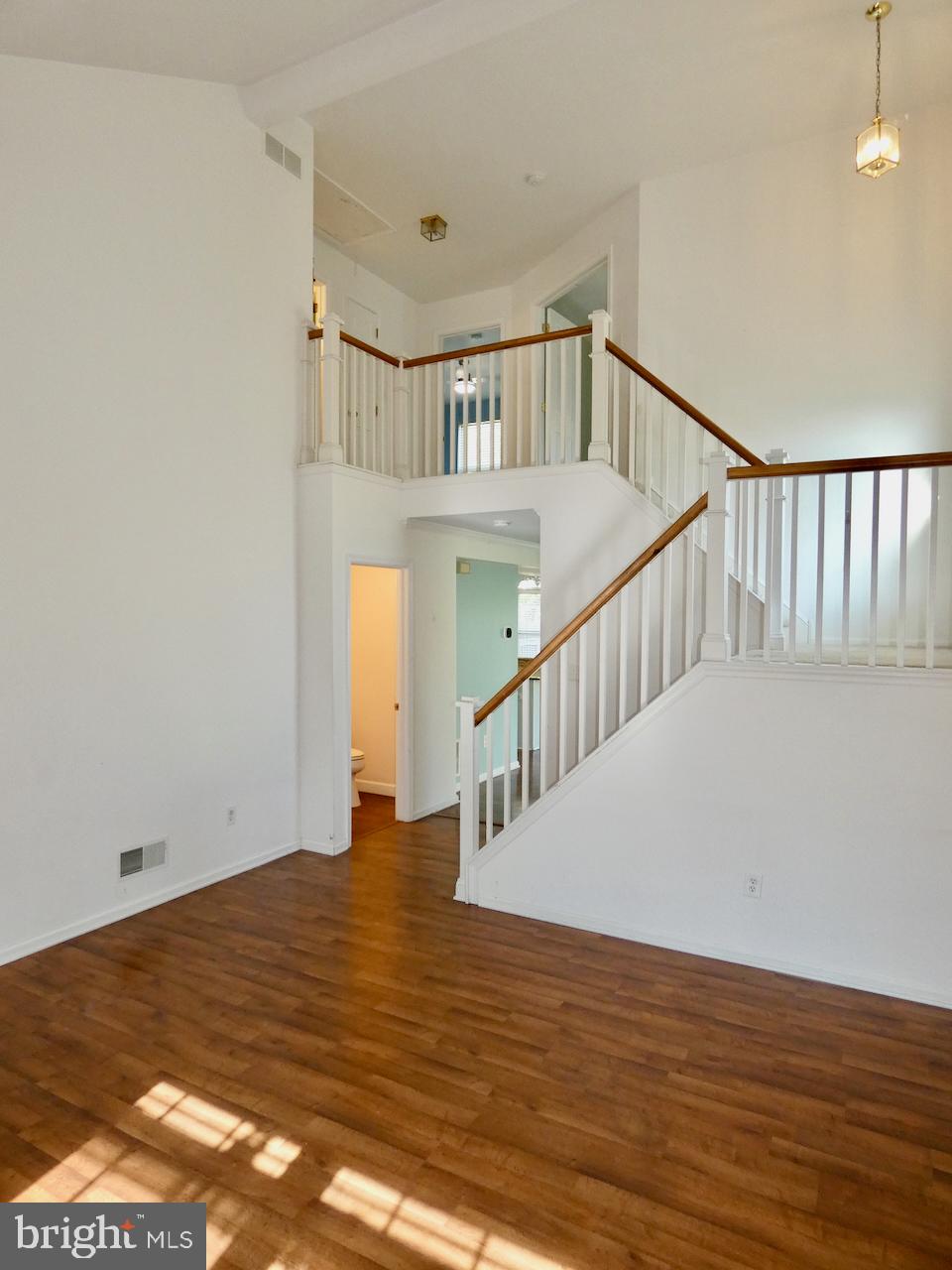 335 Marldale Drive Middletown, DE 19709 - Photo 5 of 58 a view of an empty room with wooden floor