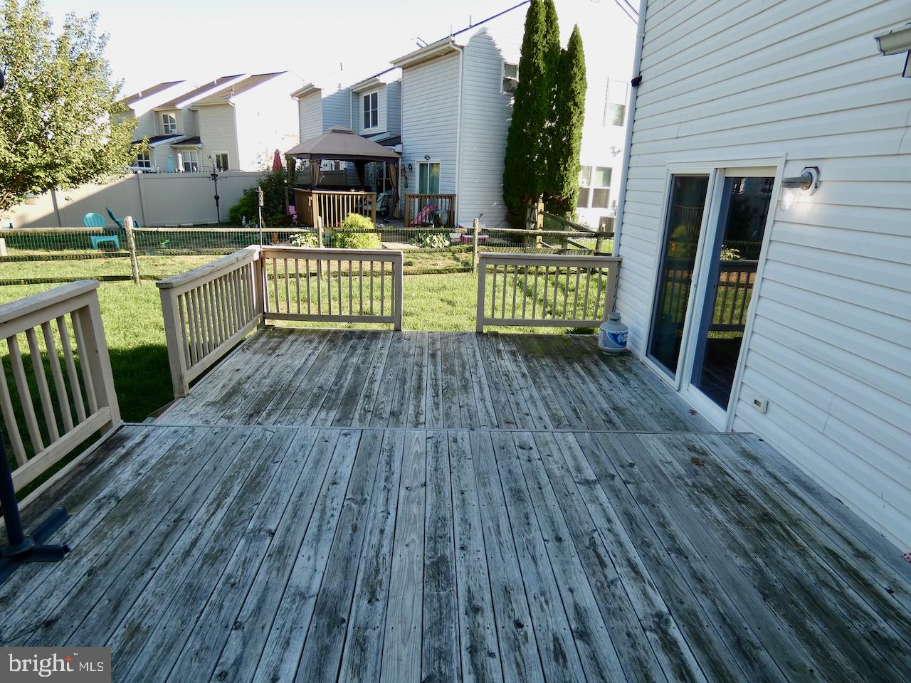 335 Marldale Drive Middletown, DE 19709 - Photo 54 of 58 a view of a house with wooden deck and furniture