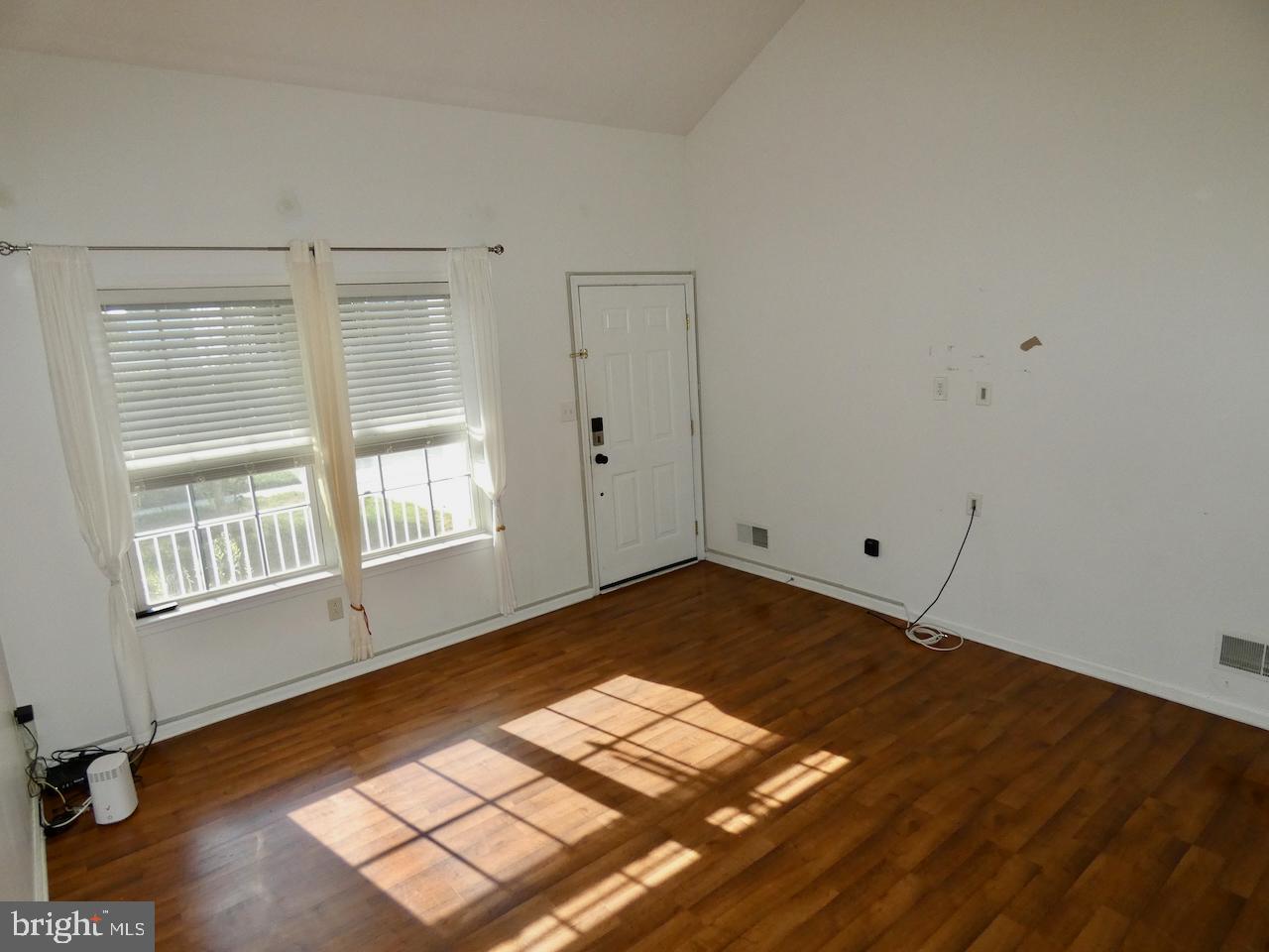 335 Marldale Drive Middletown, DE 19709 - Photo 6 of 58 a view of a room with wooden floor and windows