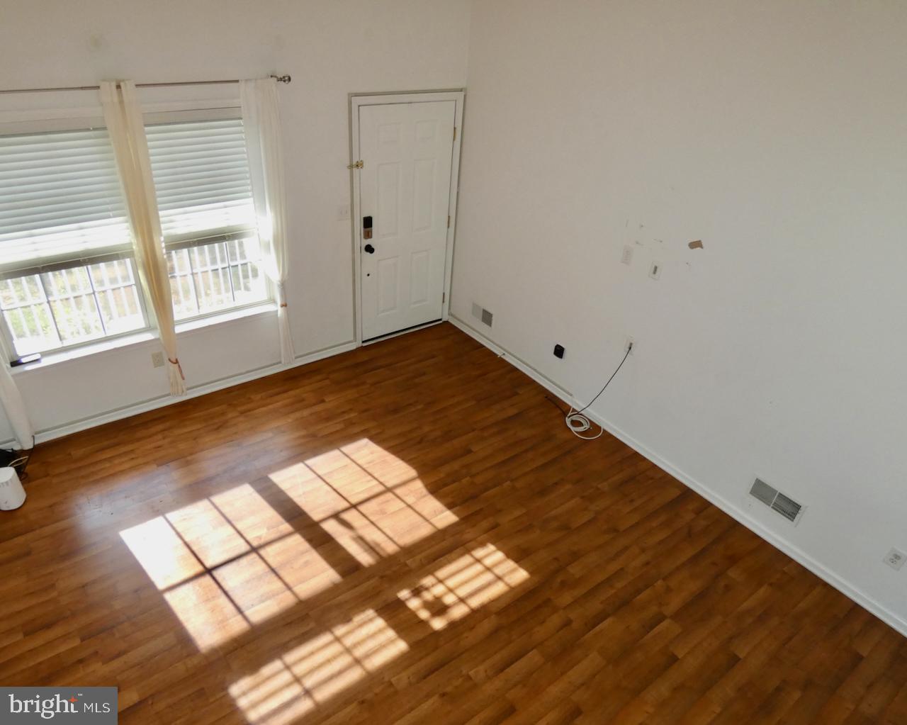335 Marldale Drive Middletown, DE 19709 - Photo 9 of 58 a view of empty room with wooden floor