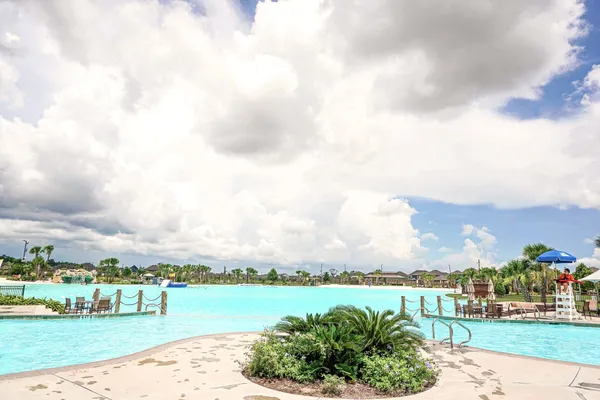 a swimming pool with yard barbeque oven and outdoor seating