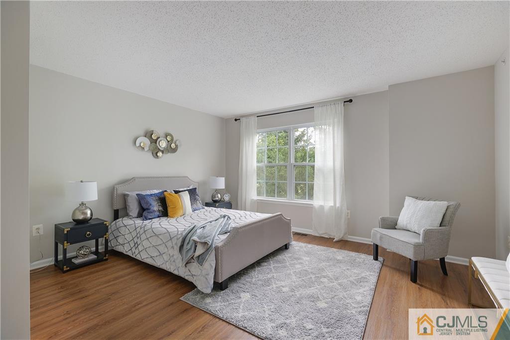 53 Prestwick Way Edison, NJ 08820 - Photo 13 of 28 a bedroom with a bed and a window